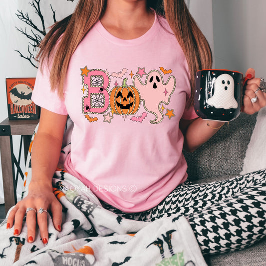 Get ready to celebrate Halloween in style with our adorable Halloween Graphic Tee! This boo-tiful shirt features charming designs of playful jack-o-lanterns and friendly ghosts that are sure to put a smile on everyone’s face. Perfect for spooky season, this tee is not just cute, it’s also super comfortable, making it your go-to choice for all your Halloween festivities!

👻 **Key Features:**

- Eye-catching graphic of cheerful jack-o-lanterns and whimsical ghosts

- Soft, breathable fabric that feels great 