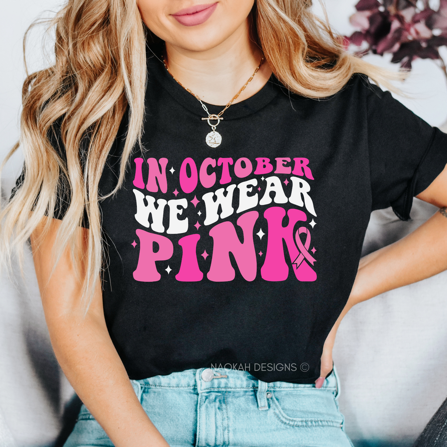 looking for a stylish way to show your support? look no further! our "in october we wear pink" black t-shirt is the perfect choice for anyone who loves complimenting and supporting others. with its retro-inspired design, this shirt not only helps spread awareness for breast cancer awareness month but also makes a bold fashion statement. made with high-quality materials, it offers both comfort and durability. join the movement and wear your support proudly with this must-have t-shirt.