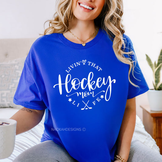 hockey mom shirt, livin' that hockey mom life t-shirt, hockey mom apparel, ice hockey mom shirt, sports mom t-shirts, hockey mom gifts, funny hockey mom shirt, custom hockey mom shirt, hockey family shirt, youth hockey mom shirt, personalized hockey mom clothing, trendy sports mom shirts, hockey mom merchandise, graphic tee for hockey moms, women's hockey fan apparel, ice hockey lifestyle shirt, team spirit shirts for moms, comfortable sportswear for moms, casual wear for hockey moms